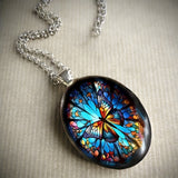 Stained Glass Butterfly Oval Pendant Necklace: A Symbol of Transformation and Radiance