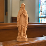 Round carving of Our Lady of Lourdes in beech wood: Sacred beauty, handcrafted technique