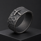 Hand-carved stone cross ring carries His gentle protection