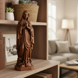 Wooden statue of Our Lady of Lourdes praying