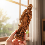 Wooden statue of Our Lady of Lourdes praying