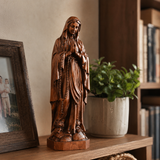 Wooden statue of Our Lady of Lourdes praying
