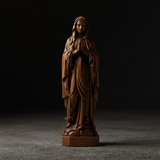 Wooden statue of Our Lady of Lourdes praying