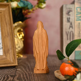 Round carving of Our Lady of Lourdes in beech wood: Sacred beauty, handcrafted technique - BGCOPPER
