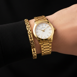All gold wrist with gold watch