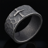 Hand-carved stone cross ring carries His gentle protection