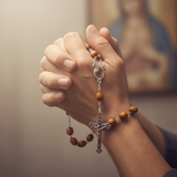 Draped over praying hands