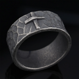 Hand-carved stone cross ring carries His gentle protection