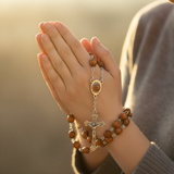 Wrapped around hand in prayer
