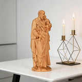 Beechwood roundel of Joseph holding a child: sacred heritage, warmth and eternity