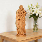 Beechwood roundel of Joseph holding a child: sacred heritage, warmth and eternity