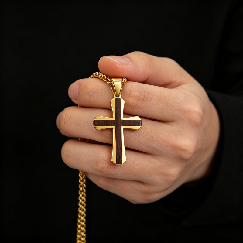 Gold Christian solid rosewood cross necklace held in hand