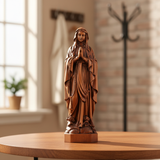 Wooden statue of Our Lady of Lourdes praying