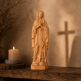 Round carving of Our Lady of Lourdes in beech wood: Sacred beauty, handcrafted technique