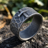 Hand-carved stone cross ring carries His gentle protection
