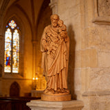 Beechwood roundel of Joseph holding a child: sacred heritage, warmth and eternity