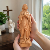 Round carving of Our Lady of Lourdes in beech wood: Sacred beauty, handcrafted technique
