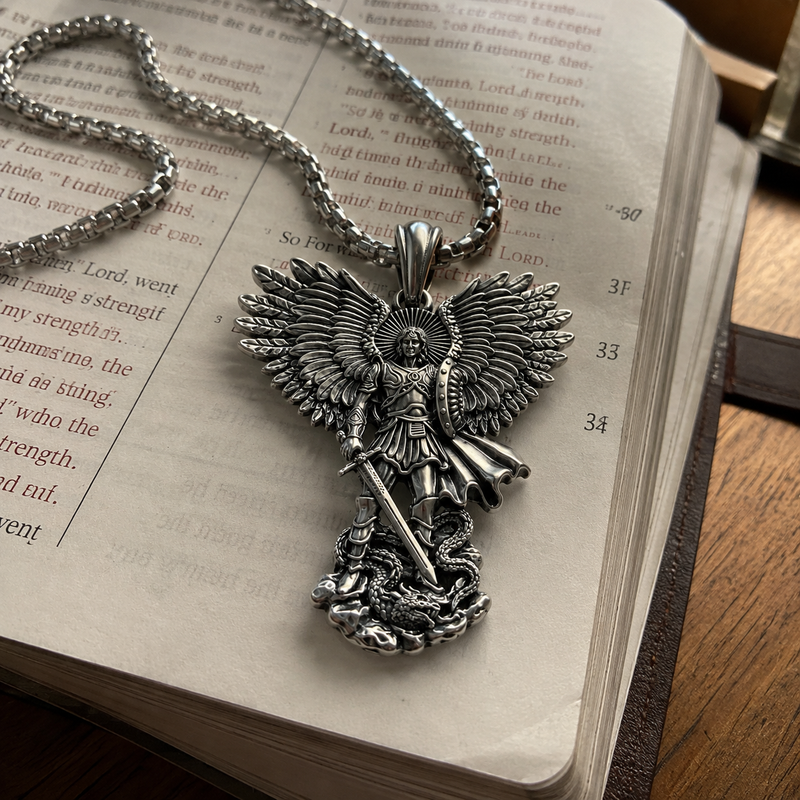 Saint Michael pendant resting on an open Bible