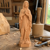 Round carving of Our Lady of Lourdes in beech wood: Sacred beauty, handcrafted technique