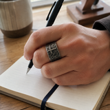 Hand-carved stone cross ring carries His gentle protection