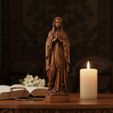 Wooden statue of Our Lady of Lourdes praying