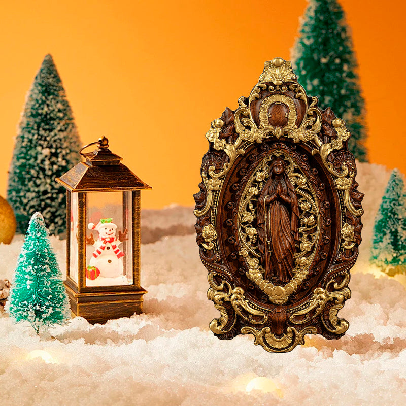 Wood carving of the Virgin Mary in leaves