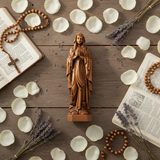 Wooden statue of Our Lady of Lourdes praying