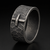 Hand-carved stone cross ring carries His gentle protection