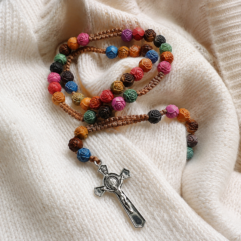 Colorful carved rose beads and vintage silver crucifix rosary detail