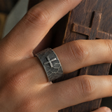 Hand-carved stone cross ring carries His gentle protection