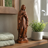 Wooden statue of Our Lady of Lourdes praying