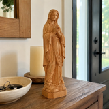 Round carving of Our Lady of Lourdes in beech wood: Sacred beauty, handcrafted technique