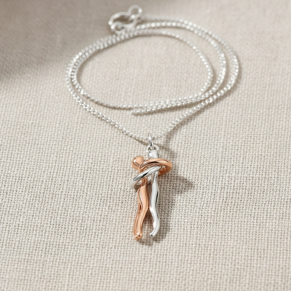 The necklace being worn, gracefully complementing the wearer's neckline