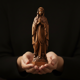 Wooden statue of Our Lady of Lourdes praying