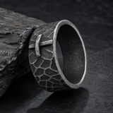 Hand-carved stone cross ring carries His gentle protection