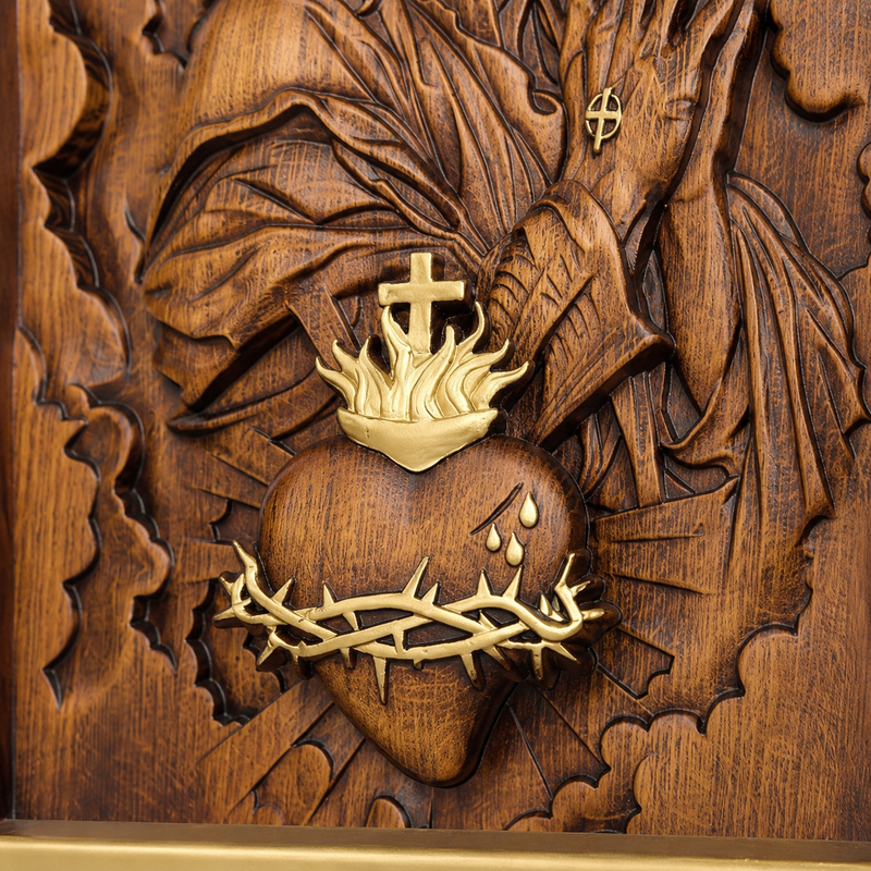 Sacred Heart of Jesus plaque beside Bible and devotional items