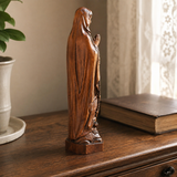 Wooden statue of Our Lady of Lourdes praying