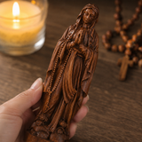 Wooden statue of Our Lady of Lourdes praying