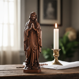 Wooden statue of Our Lady of Lourdes praying