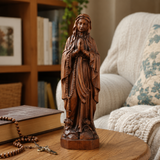 Wooden statue of Our Lady of Lourdes praying