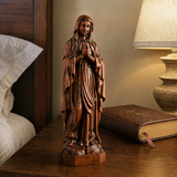 Wooden statue of Our Lady of Lourdes praying