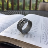 Hand-carved stone cross ring carries His gentle protection