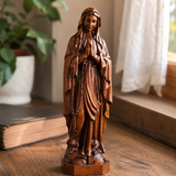 Wooden statue of Our Lady of Lourdes praying