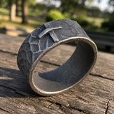 Hand-carved stone cross ring carries His gentle protection