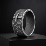 Hand-carved stone cross ring carries His gentle protection