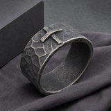 Hand-carved stone cross ring carries His gentle protection