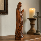 Wooden statue of Our Lady of Lourdes praying