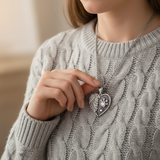 Female model grey knit - hand touching locket tender