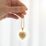 Hand holding chain - bright window light halo