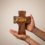 Hands holding cross front view